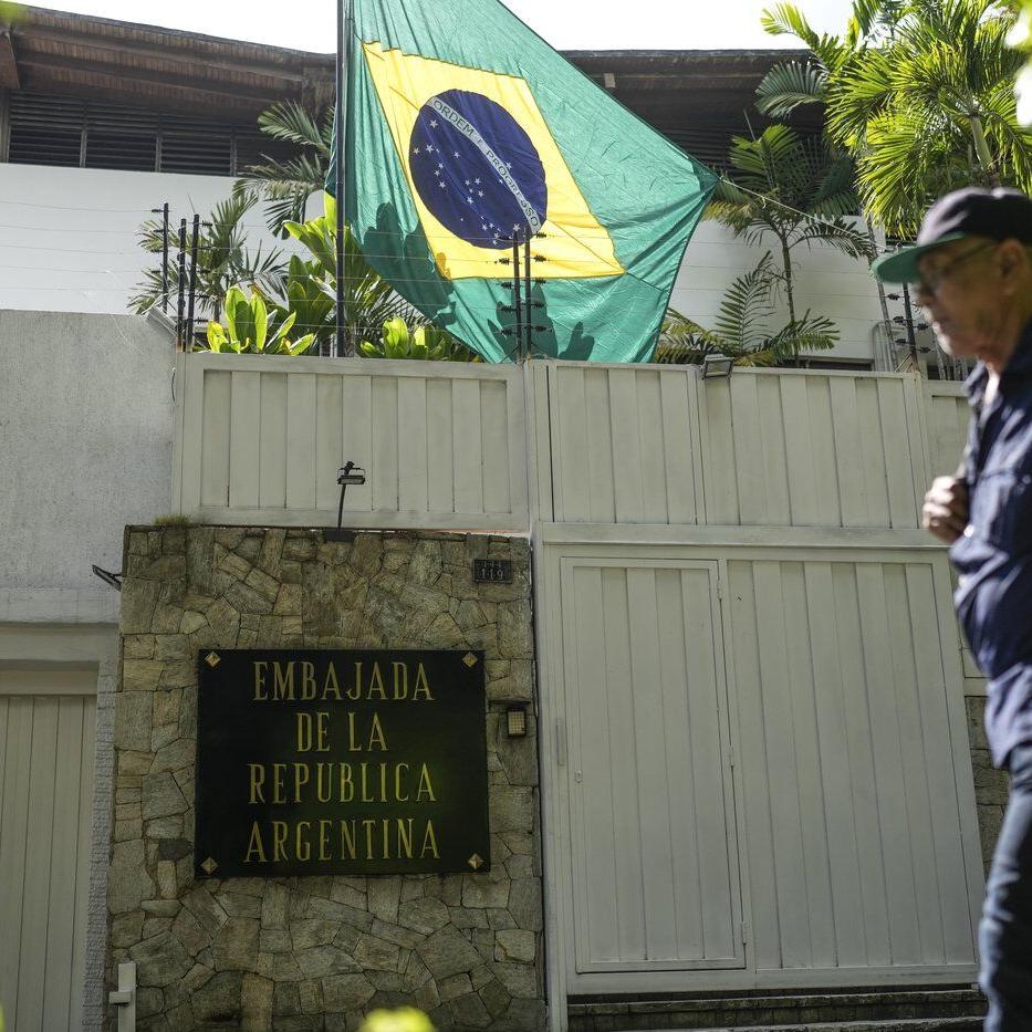 Sheltered Venezuelan government opponents decry police and intelligence agents outside embassy